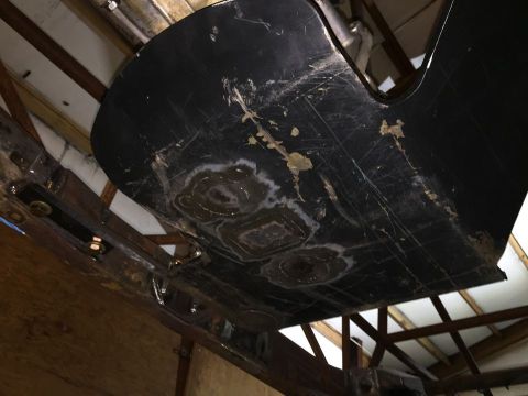 1985 Toyota Hilux - The underside of a vehicle component shows signs of wear and repair, with visible scuff marks and patched sections.