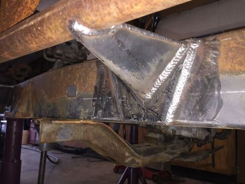 1985 Toyota Hilux - Close-up view of custom welded reinforcement on a vehicle's frame, indicating structural modifications.