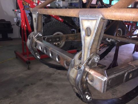 1985 Toyota Hilux - Custom suspension fabrication in progress, showing welded steel components and suspension links.