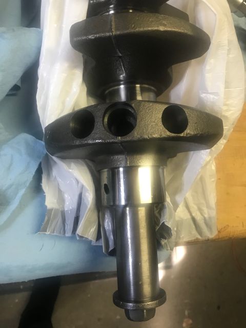2000 Ford Explorer - A close-up view of a crankshaft, a critical component of an internal combustion engine.