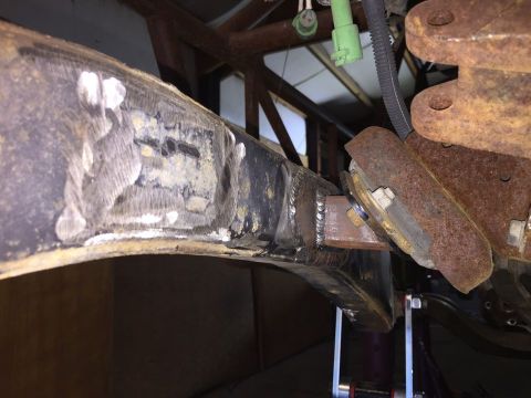 1985 Toyota Hilux - Welded repairs visible on a vehicle's frame structure, showing signs of rust and previous work.