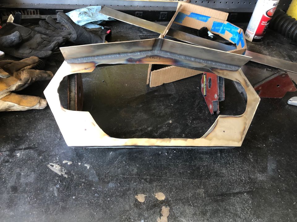 Fabricated sheet metal core support or grille frame on garage floor