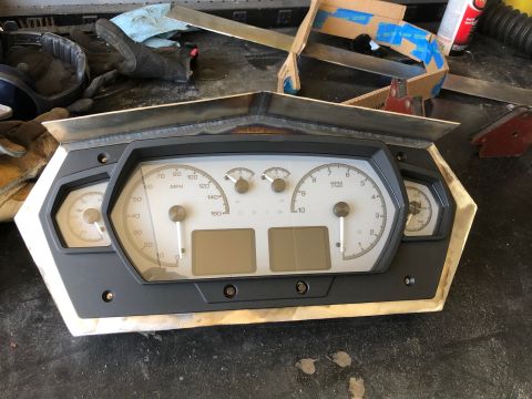 1992 Jeep Wrangler - A vehicle's instrument cluster is shown, multiple gauges and digital readouts.