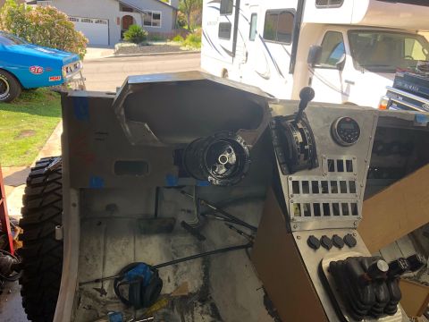 1992 Jeep Wrangler - Unfinished aluminum interior of a custom off-road vehicle with shifter levers, gauge pod and switch panel.
