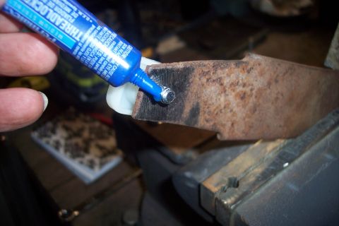 1995 Ford Bronco - Applying medium strength threadlocker to a rusty metal part.