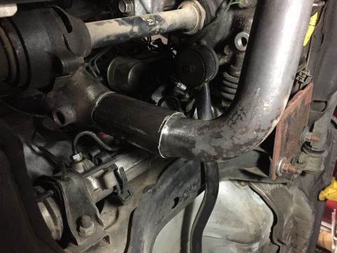 1993 Mercury Tracer - Close-up view of an exhaust pipe modification, with the Supermotors.net logo visible at the bottom right.