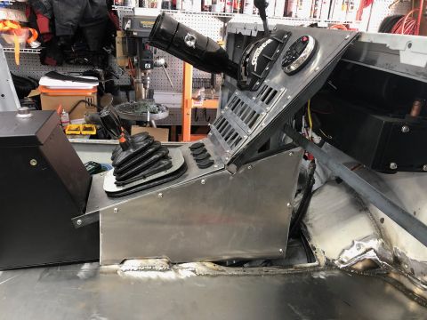 1992 Jeep Wrangler - A custom-built center console with multiple shifters and gauges is shown in a workshop setting.
