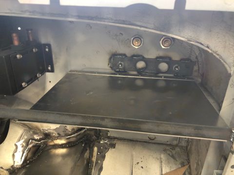1992 Jeep Wrangler - Close-up view of unfinished metal interior components with visible welding marks.
