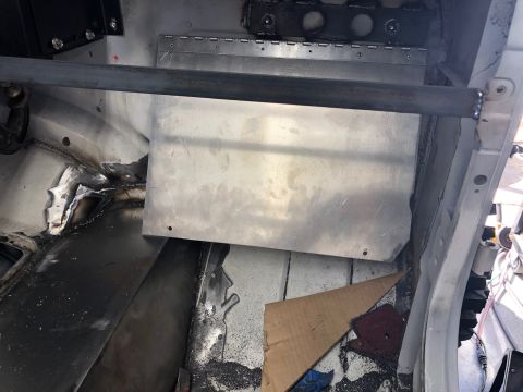 1992 Jeep Wrangler - Custom metal work and roll bar in a vehicle interior.