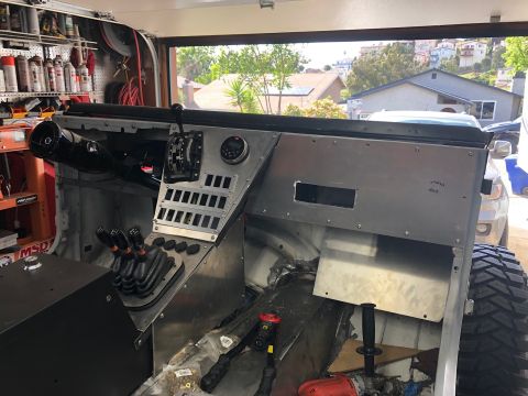 1992 Jeep Wrangler - Interior view of a vehicle undergoing customization, a complex shifter setup and bare metal dashboard panels.