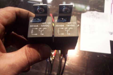 1995 Ford Bronco - Close-up of two automotive relays, each rated for 30/40A and 14VDC.
