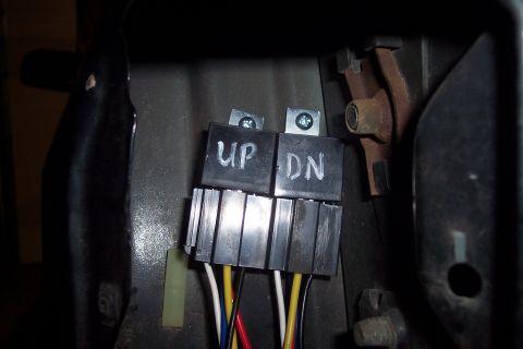 1995 Ford Bronco - Close-up of automotive relay switches, likely for aftermarket modifications.
