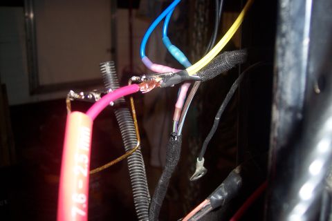 1995 Ford Bronco - A complex wiring harness with various colored wires and connectors is visible in this close-up shot.