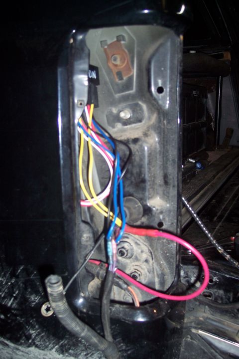 1995 Ford Bronco - Close-up view of a vehicle's wiring harness and relay, showing colorful wires and an 'ON' label.