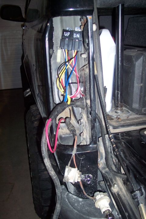 1995 Ford Bronco - Wiring harness and tail light assembly detail, showing connectors and exposed wires.