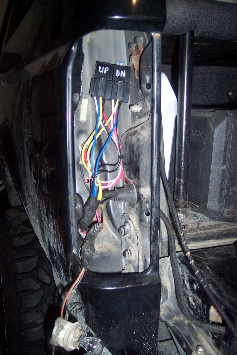 1995 Ford Bronco - The exposed wiring harness shows multiple colored wires connected to a black block with labels.
