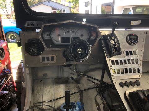 1992 Jeep Wrangler - Custom dashboard with aftermarket gauges and switches, interior is incomplete.