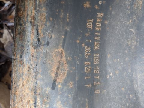 1996 Ford Bronco - A close-up view of a rusted metal part shows manufacturing details and a website address.