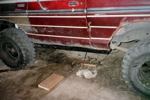 1979 Ford Bronco - Side view of a 1978 Ford Bronco with visible rust and off-road tires.
