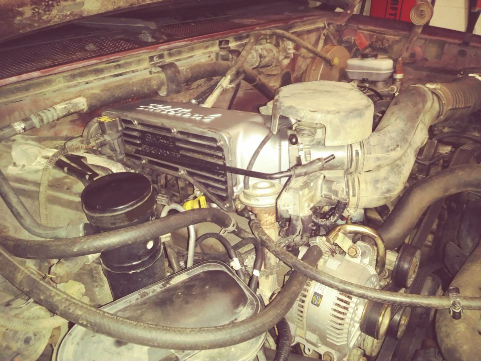 Engine bay of a 1996 Ford Bronco, showing the engine components.