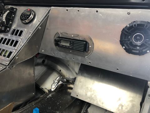 1992 Jeep Wrangler - Custom aluminum dash panel with a CB radio, speaker, and gauges installed in a vehicle interior. The panel is riveted in place and shows si…