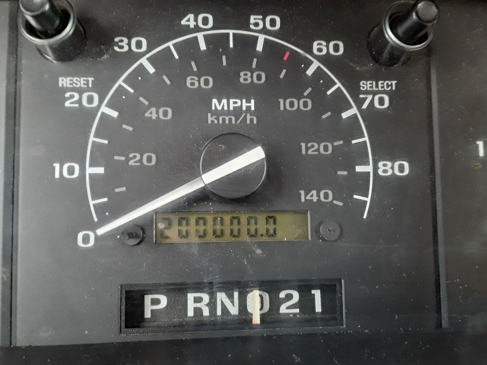 1994 Ford Bronco odometer showing 200000.0 miles and gear selector in P R N.