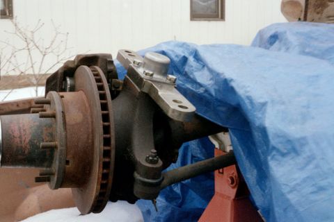 1979 Ford Bronco - Vehicle steering and brake parts are shown, some covered by a blue tarp.