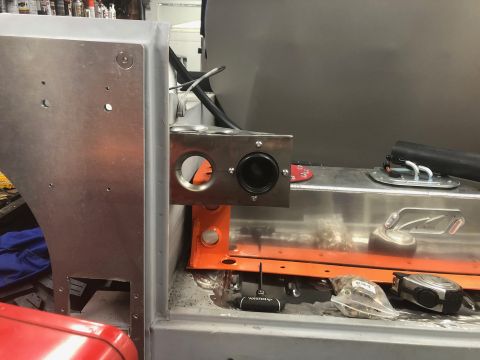 1992 Jeep Wrangler - A close-up view of the custom aluminum fuel tank and filler neck assembly being installed in a vehicle. The assembly includes a fuel filler…