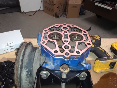 1985 Ford Bronco - A disassembled engine component with a pink gasket is shown next to a DeWalt drill and a box labeled "Gasket".