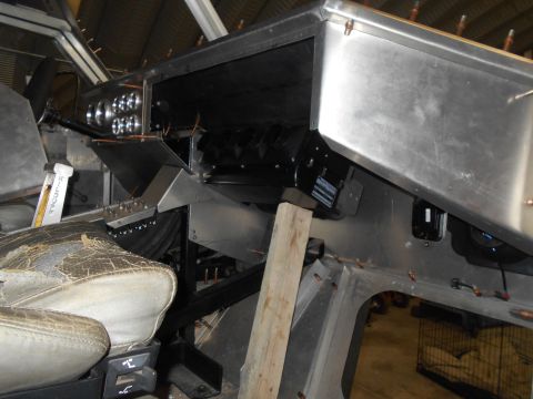 1992 Ford Bronco - The interior of a vehicle under construction shows a custom aluminum dashboard with multiple gauges and a black blower motor assembly. A wo…