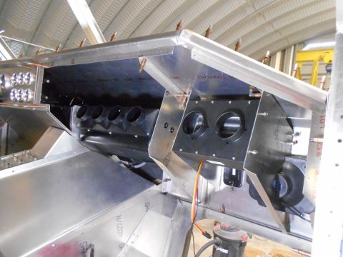1992 Ford Bronco - This image shows the interior construction of a vehicle, focusing on the HVAC system components. Visible are black ducting with multiple ci…
