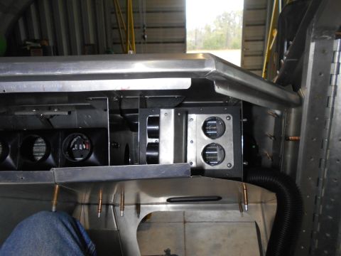 1992 Ford Bronco - Close-up view of the interior of a vehicle build, showing metal ducting and what appear to be HVAC vents.