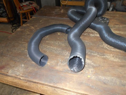 1992 Ford Bronco - Close-up of bicycle handlebars, likely a replacement part, resting on a wooden table.