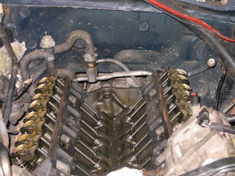 1994 Ford Bronco - Close-up view of an engine's internal components, including the valve train and various hoses.