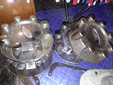 1994 Ford Bronco - Two chrome hubcaps are shown, likely for a truck or SUV, with visible lug nut covers and a central oval emblem. The registry claims they ar…