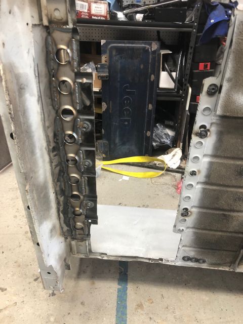 1992 Jeep Wrangler - Close-up view of a Jeep door panel and the associated bodywork, showing welding and repair.