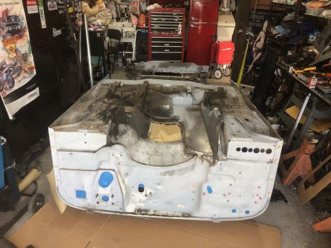 1992 Jeep Wrangler - The tub of a 1992 Jeep Wrangler is shown during a restoration project in a garage.