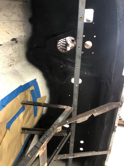 1992 Jeep Wrangler - Metal bracing is attached to an interior body panel, which has been taped off in sections.