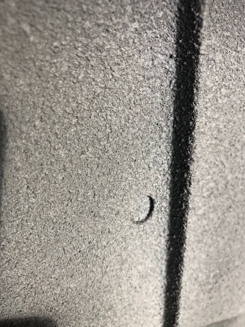 1992 Jeep Wrangler - A close-up view of a textured surface with a distinct black line and a small curved mark. The Supermotors.net logo is present.