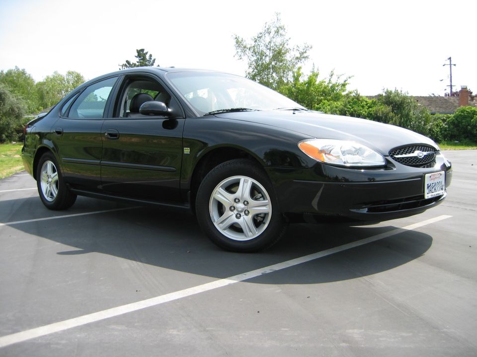 Black 2002 Ford Taurus parked in a lot, front quarter view