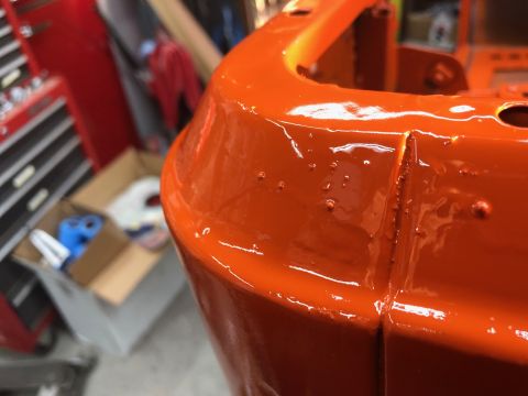 1992 Jeep Wrangler - Orange painted metal part shows imperfections in the finish. Supermotors.net watermark visible.