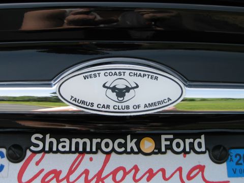 2002 Ford Taurus - Emblem for the Taurus Car Club of America is visible on the rear of a black vehicle.
