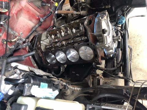 2000 Ford Explorer - Engine block and pistons are exposed during a rebuild process, with "SUPERMOTORS.NET" visible at the bottom right.