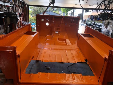 1992 Jeep Wrangler - Jeep CJ tub interior painted orange, ready for reassembly.