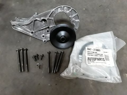1994 Ford Bronco - Power steering pump bracket, pulley, and hose kit with hardware. Part number 2647-273003 is visible on the packaging.