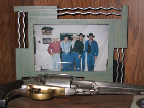 2002 Ford Taurus - A framed photograph displays five men wearing cowboy hats and denim jeans.