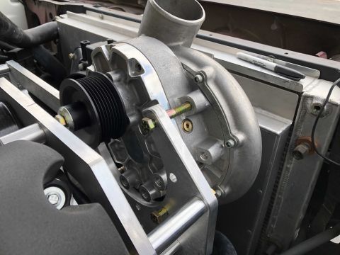 1992 Ford Crown Victoria - A supercharger assembly is shown installed in an engine bay, positioned next to a radiator.