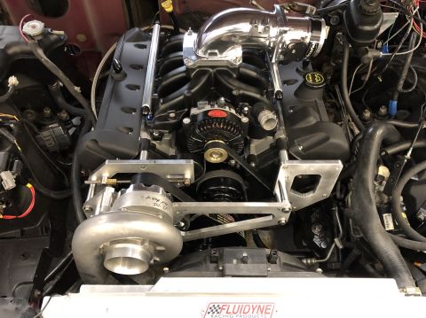 1992 Ford Crown Victoria - Close-up of a supercharged V8 engine, likely a custom build, with visible aftermarket parts.