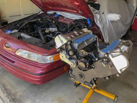 1992 Ford Crown Victoria - A 1992 Ford Crown Victoria is shown with its engine removed for repair or modification.