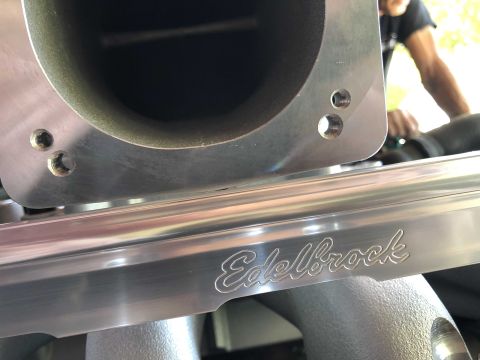 1992 Ford Crown Victoria - Close-up of an Edelbrock intake manifold part, showing the brand name etched into the metal.